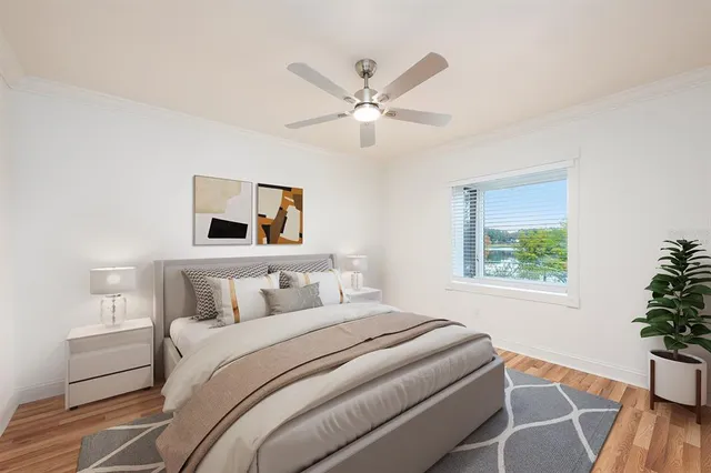 a bedroom with a large bed and a window