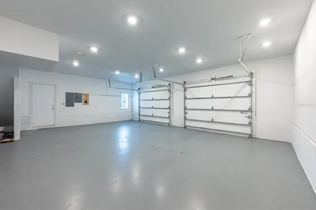 an empty room with a empty space and windows