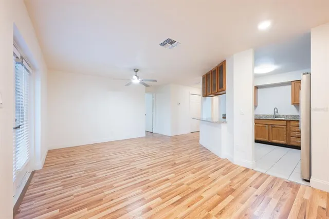a view of a kitchen with wooden floor