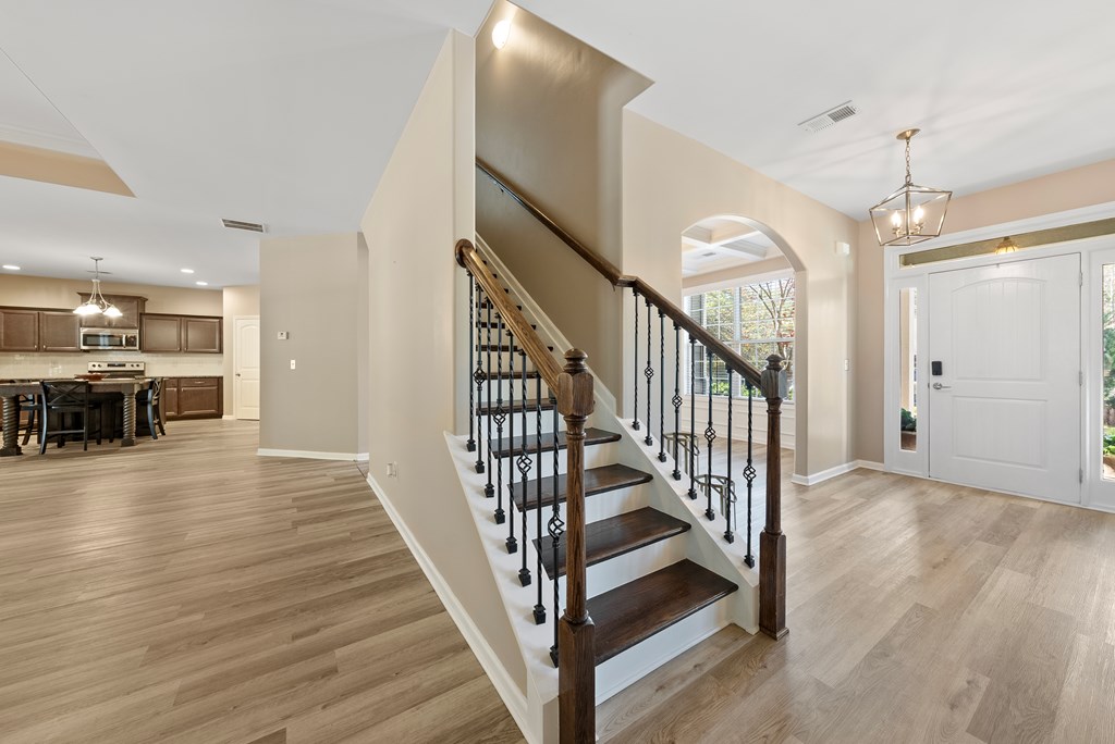 67 Pin Oak Way Hamilton, GA 31811 - Photo 20 of 65 a view of a hallway with wooden floor and staircase