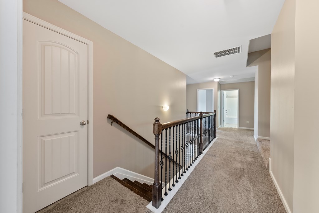 67 Pin Oak Way Hamilton, GA 31811 - Photo 21 of 65 a view of a hallway with stairs