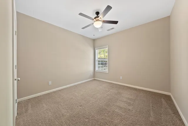 a bathroom with a tub shower and sink