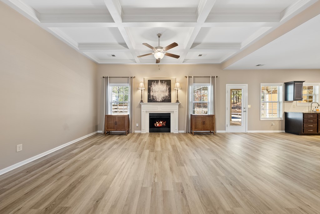 67 Pin Oak Way Hamilton, GA 31811 - Photo 3 of 65 wooden floor fireplace and windows in an empty room