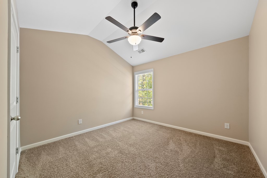 67 Pin Oak Way Hamilton, GA 31811 - Photo 35 of 65 an empty room with window and ceiling fan