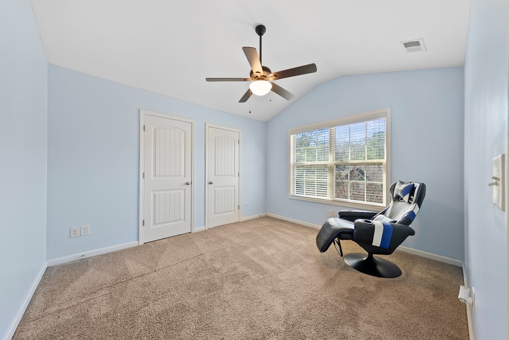 67 Pin Oak Way Hamilton, GA 31811 - Photo 39 of 65 a living room with furniture a ceiling fan and a window