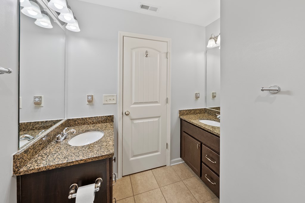 67 Pin Oak Way Hamilton, GA 31811 - Photo 40 of 65 a bathroom with a granite countertop sink and a mirror