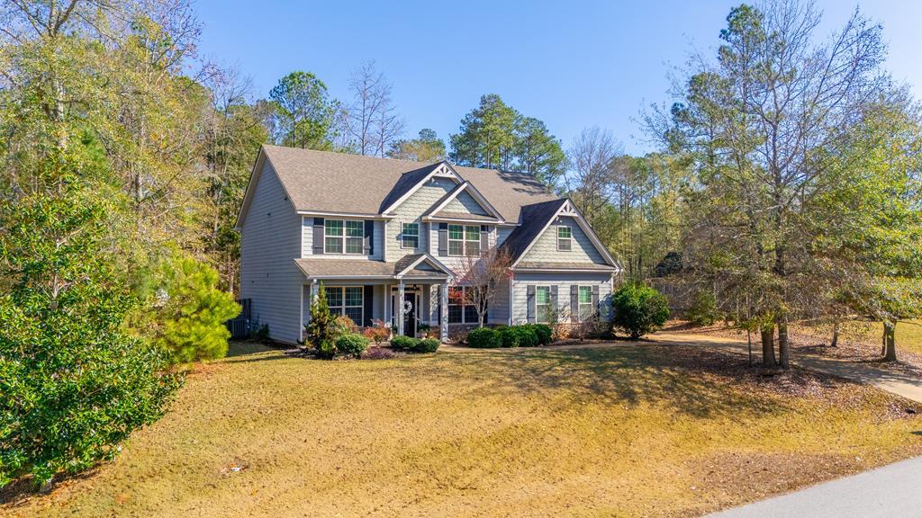 67 Pin Oak Way Hamilton, GA 31811 - Photo 63 of 65 a front view of a house with a yard table and chairs