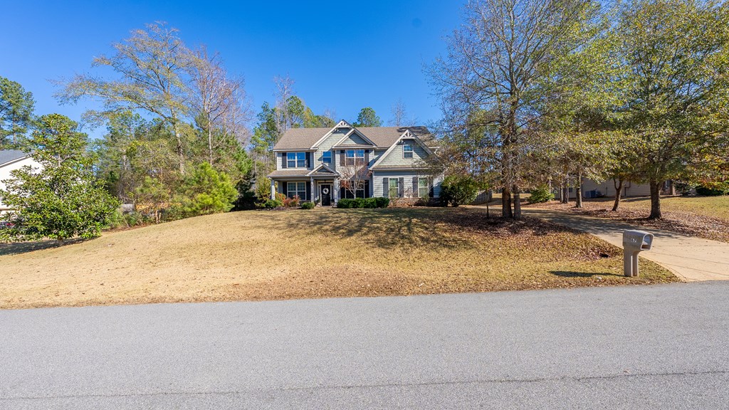 67 Pin Oak Way Hamilton, GA 31811 - Photo 64 of 65 a view of a house with a yard and sitting area