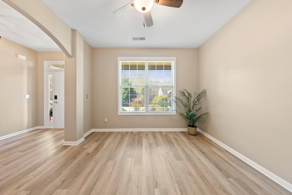 67 Pin Oak Way Hamilton, GA 31811 - Photo 7 of 65 a view of an empty room with wooden floor and a window