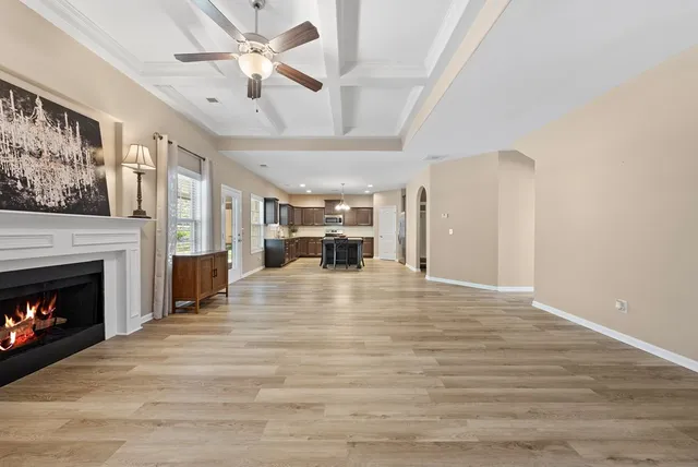 wooden floor in an empty room with a fireplace