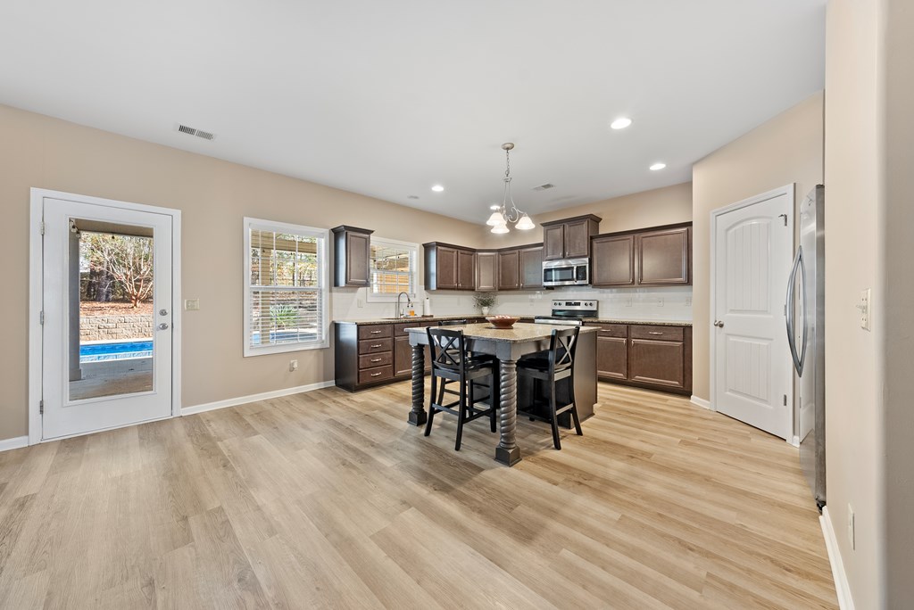 67 Pin Oak Way Hamilton, GA 31811 - Photo 10 of 65 a kitchen with a table and chairs in it