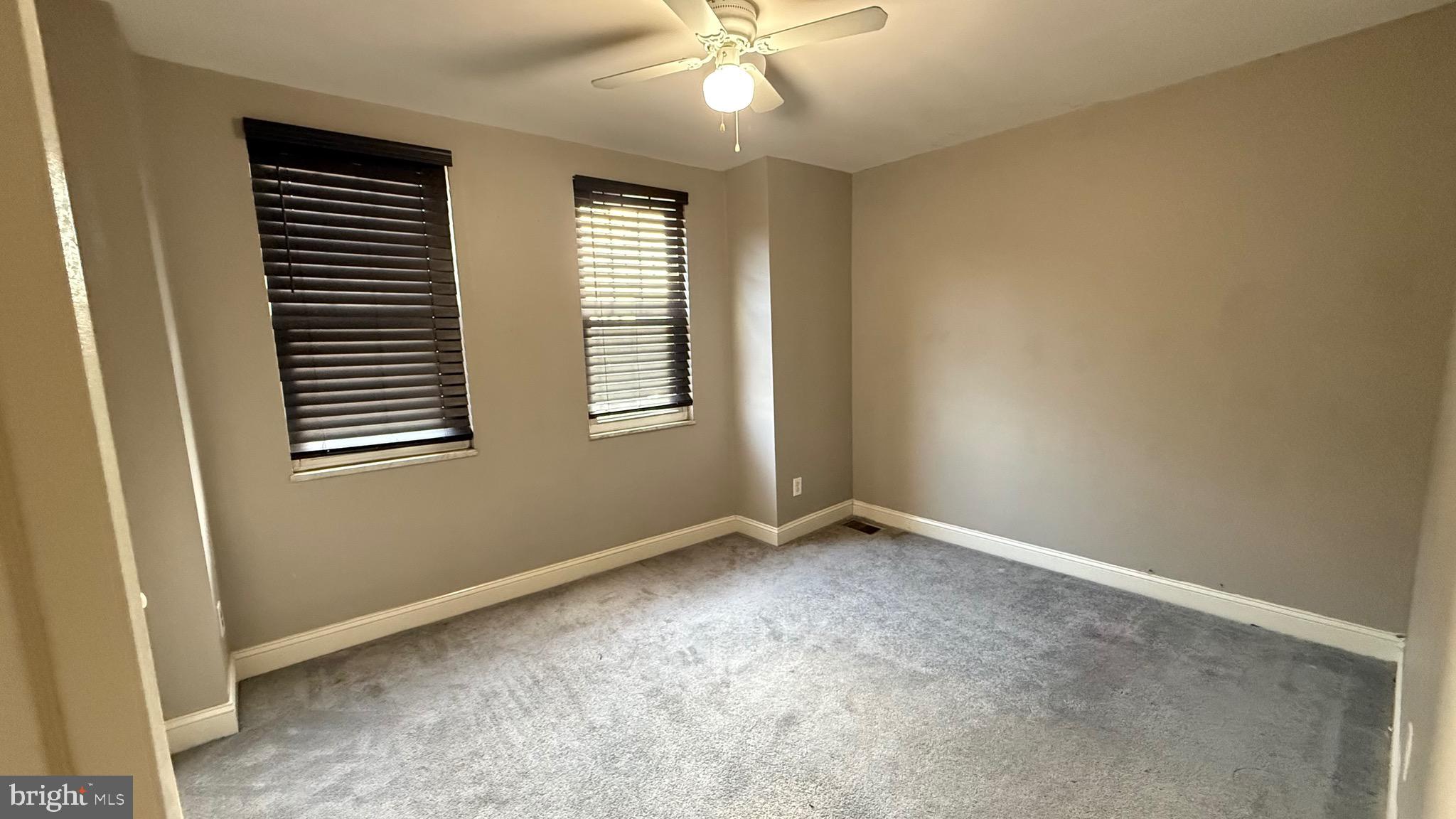 2707 Morris Street Philadelphia, PA 19145 - Photo 11 of 26 an empty room with a window and a fan