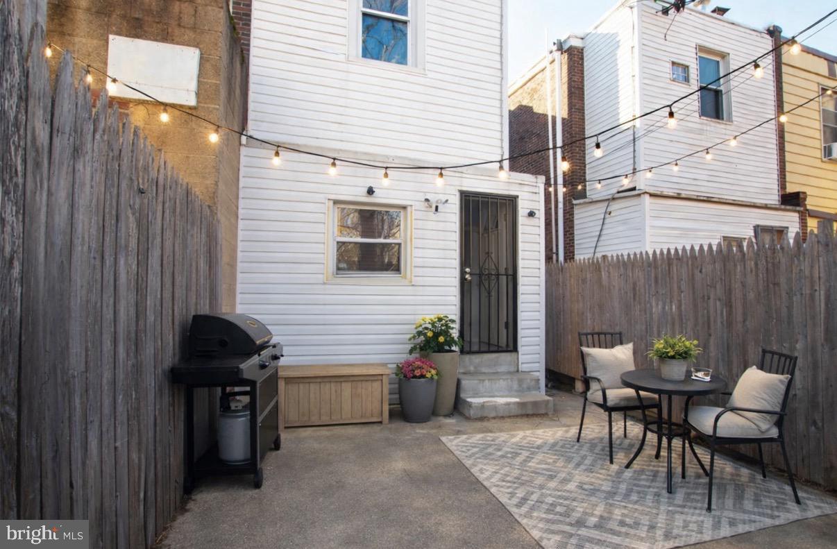2707 Morris Street Philadelphia, PA 19145 - Photo 23 of 26 a view of a patio with a table and chairs and potted plants