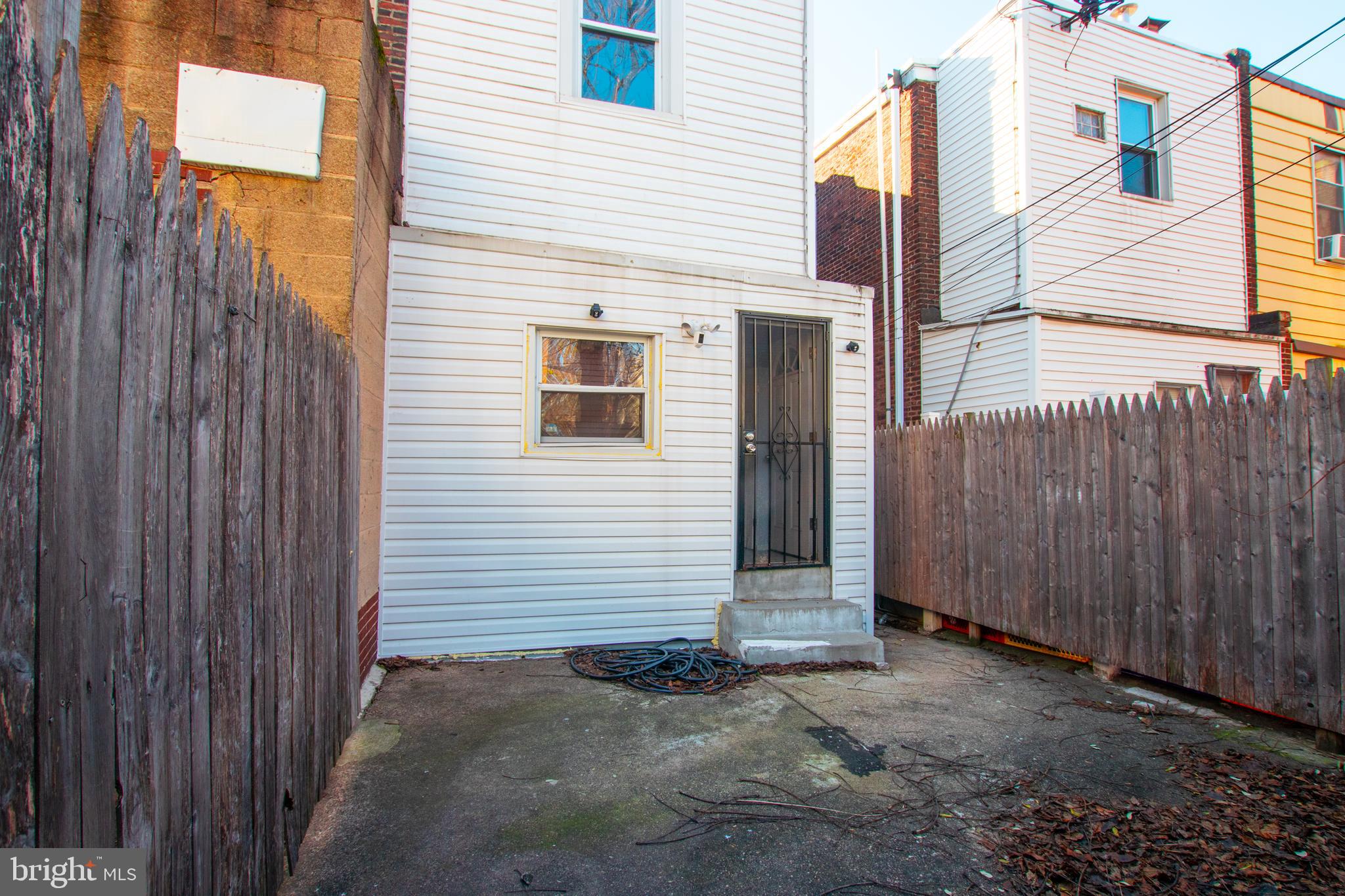 2707 Morris Street Philadelphia, PA 19145 - Photo 24 of 26 a view of a house with backyard and wooden fence