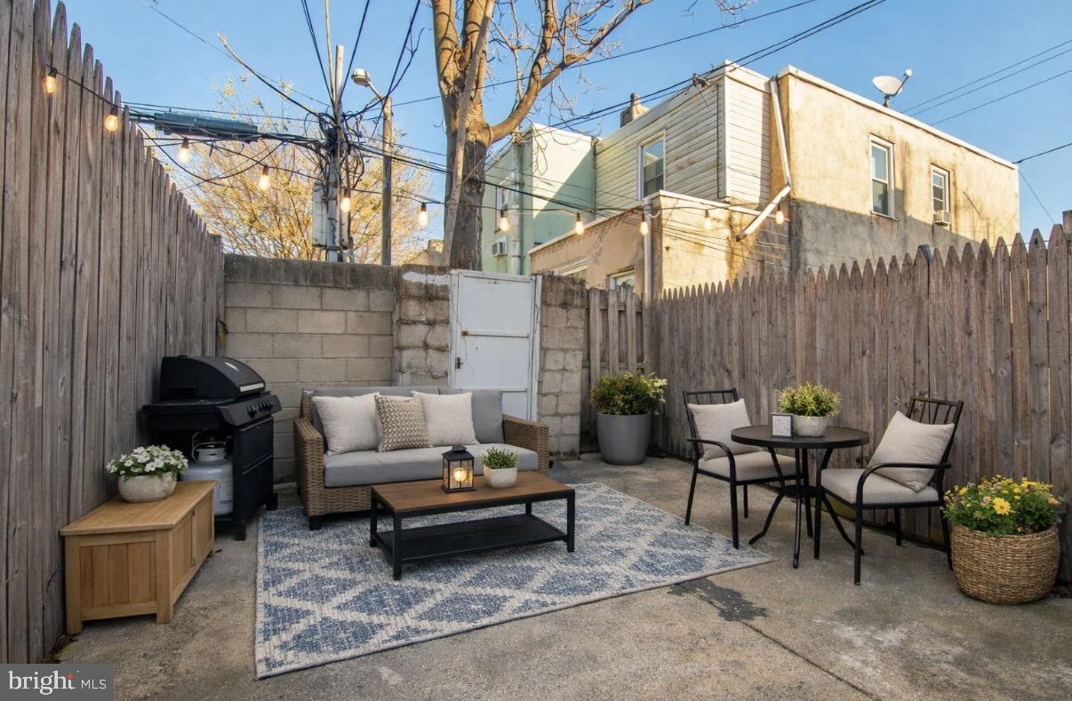 2707 Morris Street Philadelphia, PA 19145 - Photo 25 of 26 a backyard of a house with outdoor seating