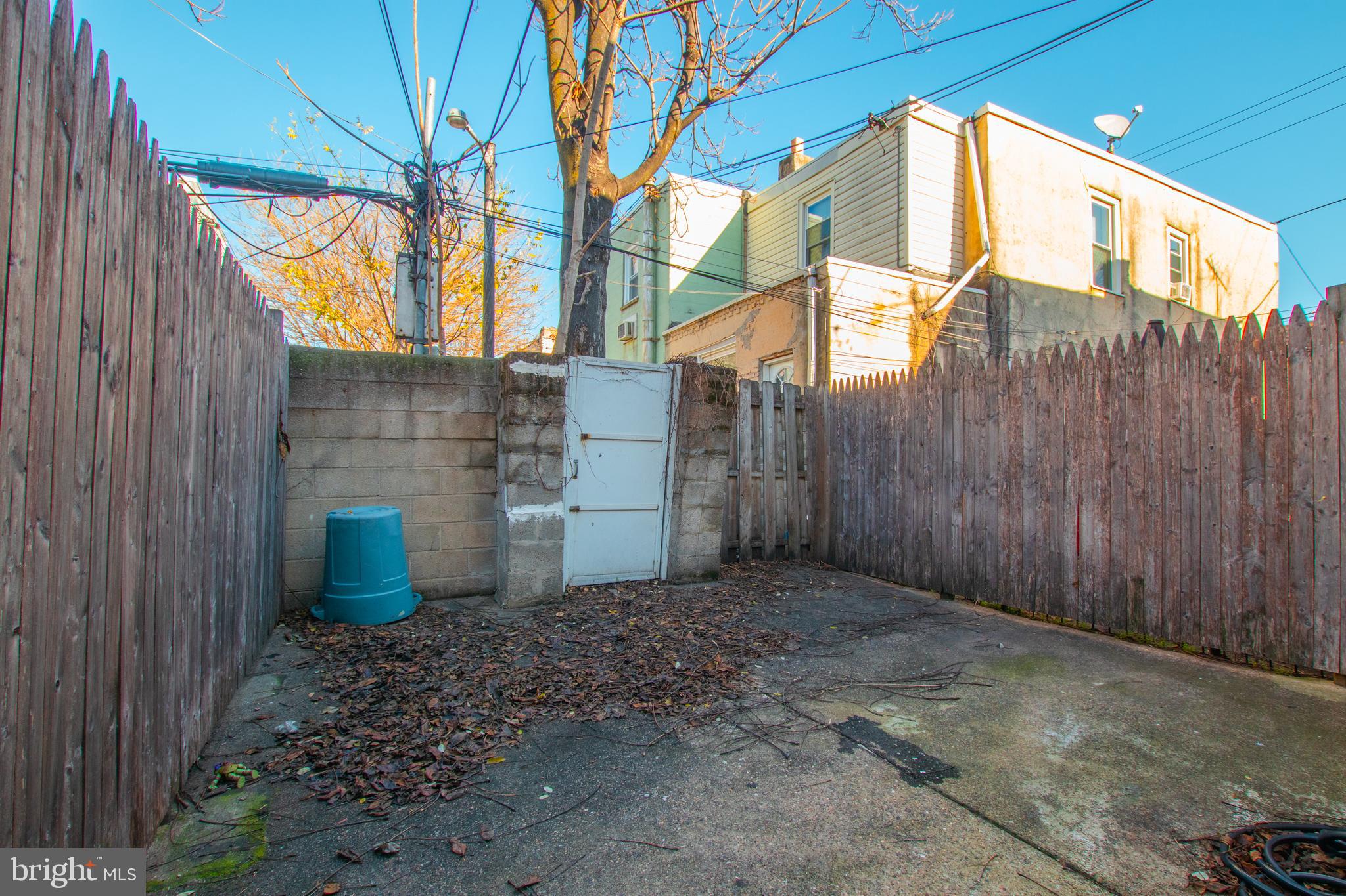 2707 Morris Street Philadelphia, PA 19145 - Photo 26 of 26 a view of a back yard and a wooden fence
