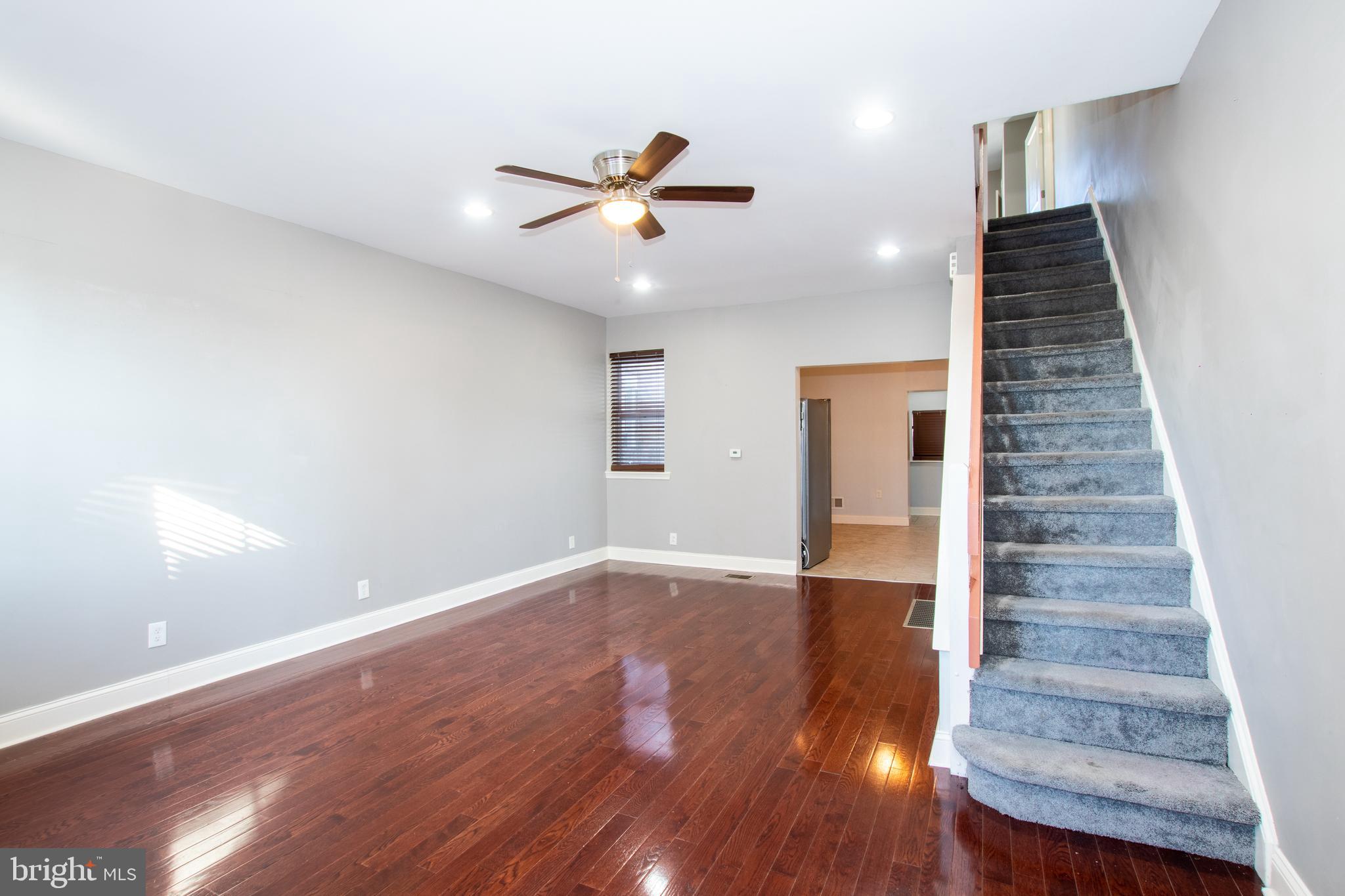 2707 Morris Street Philadelphia, PA 19145 - Photo 4 of 26 a view of an empty room with wooden floor and a ceiling fan