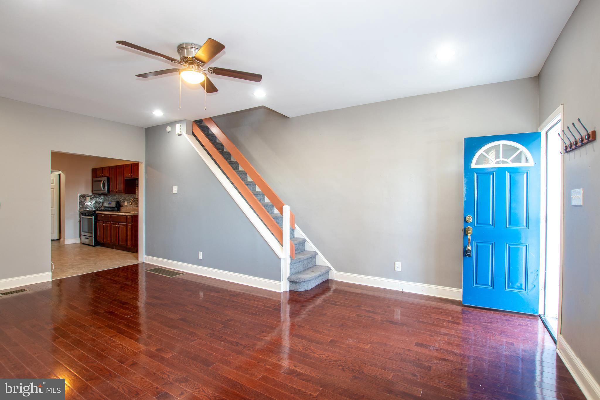 2707 Morris Street Philadelphia, PA 19145 - Photo 5 of 26 a view of an empty room with wooden floor and stairs