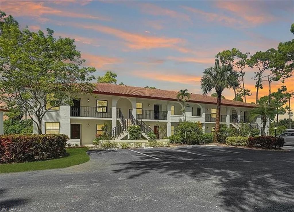905 Augusta Boulevard Naples, FL 34113 - Photo 2 of 20 front view of a house with a street