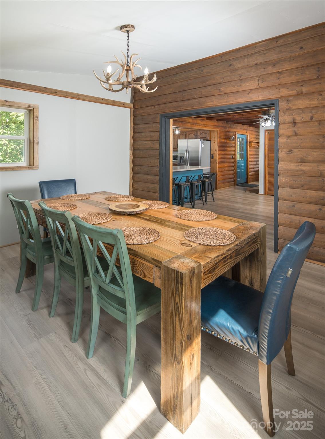 1090 Horse Bottom Road Banner Elk, NC 28604 - Photo 11 of 30 a dining room with furniture window and wooden floor