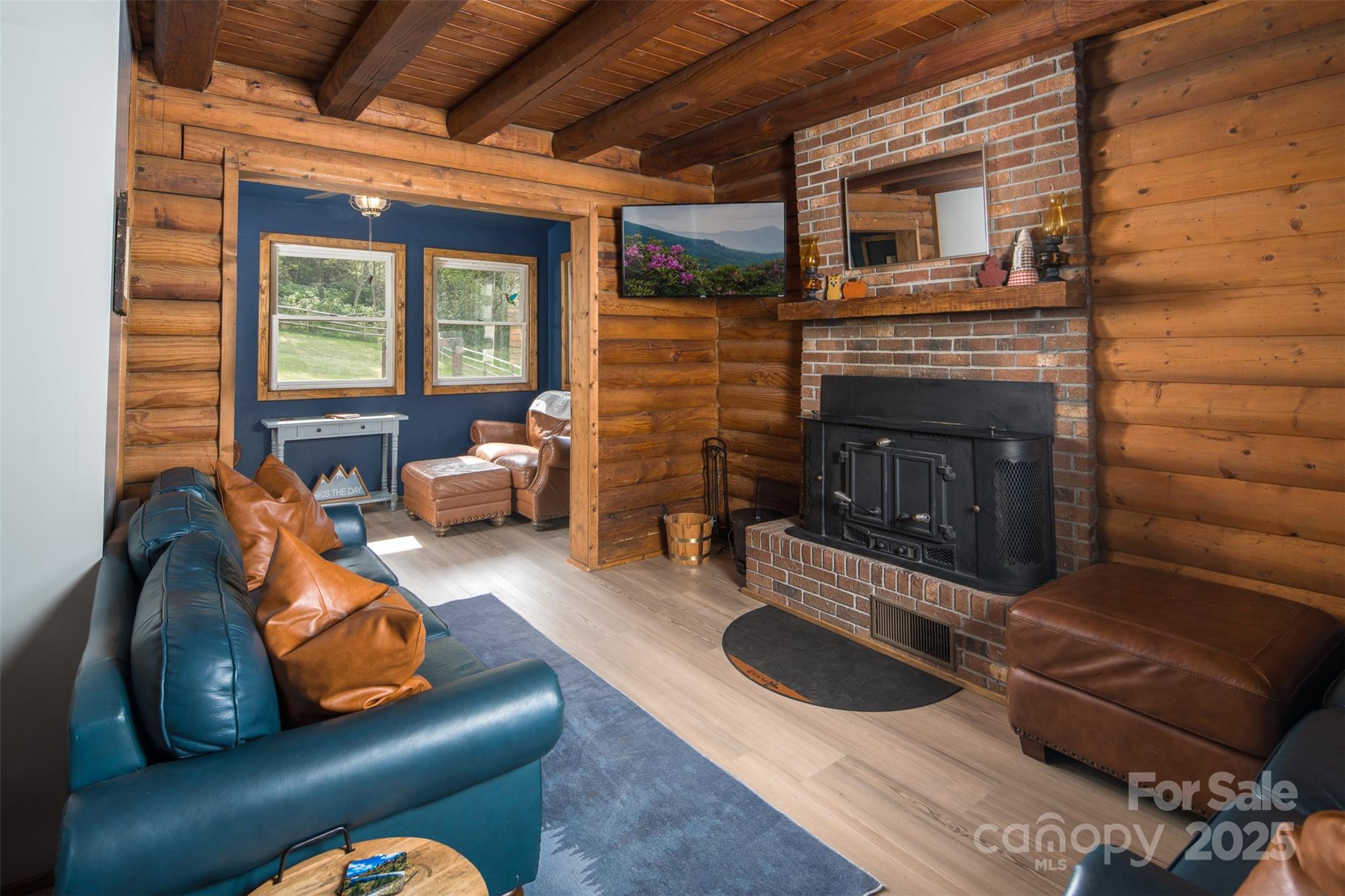 1090 Horse Bottom Road Banner Elk, NC 28604 - Photo 12 of 30 a living room with furniture and a fireplace
