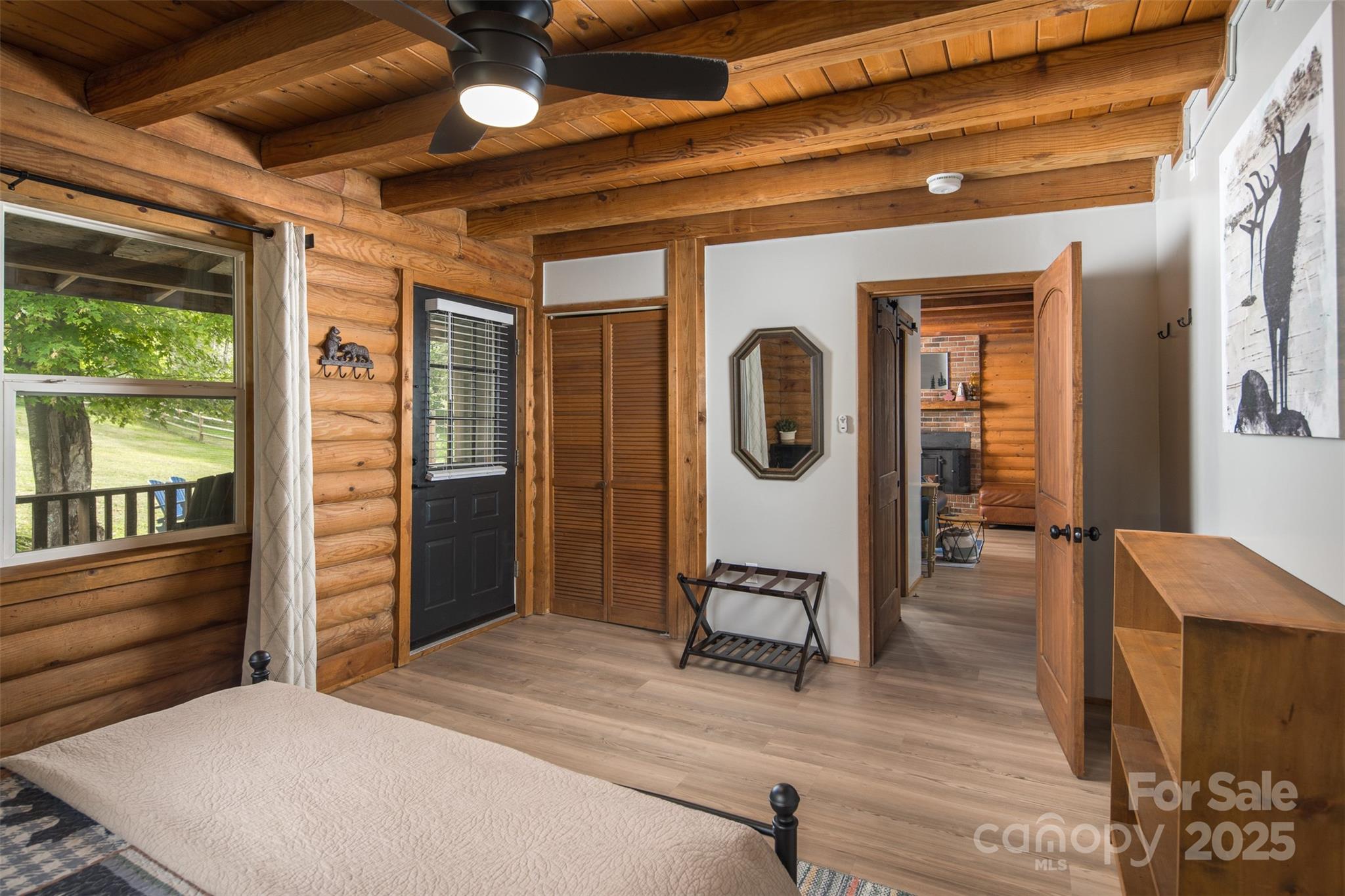 1090 Horse Bottom Road Banner Elk, NC 28604 - Photo 15 of 30 a view of a hallway with wooden floor and windows