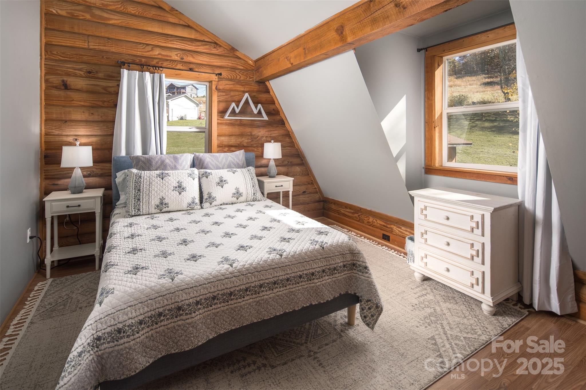 1090 Horse Bottom Road Banner Elk, NC 28604 - Photo 21 of 30 a bedroom with a large bed and a window