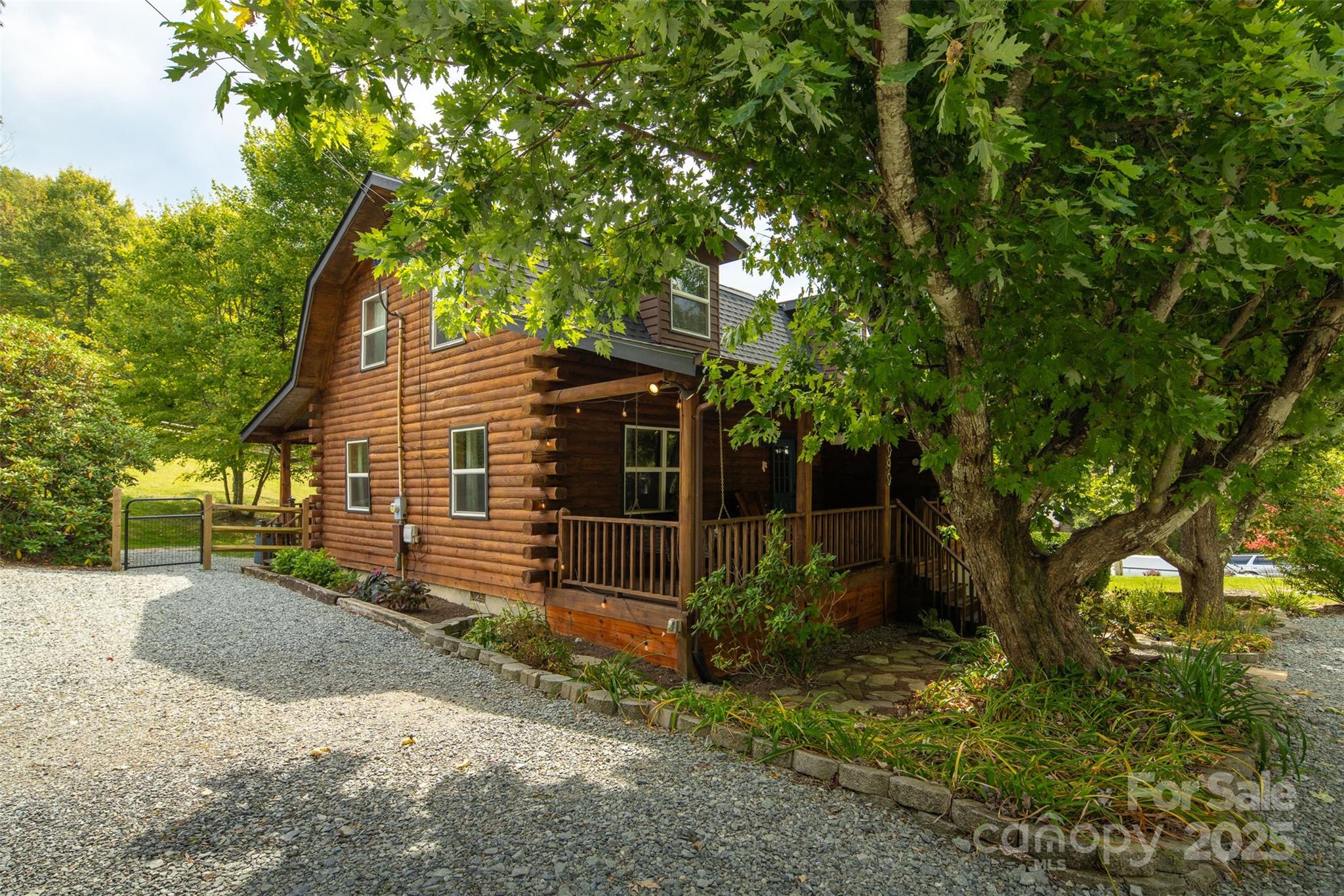 1090 Horse Bottom Road Banner Elk, NC 28604 - Photo 26 of 30 a view of a house with a yard