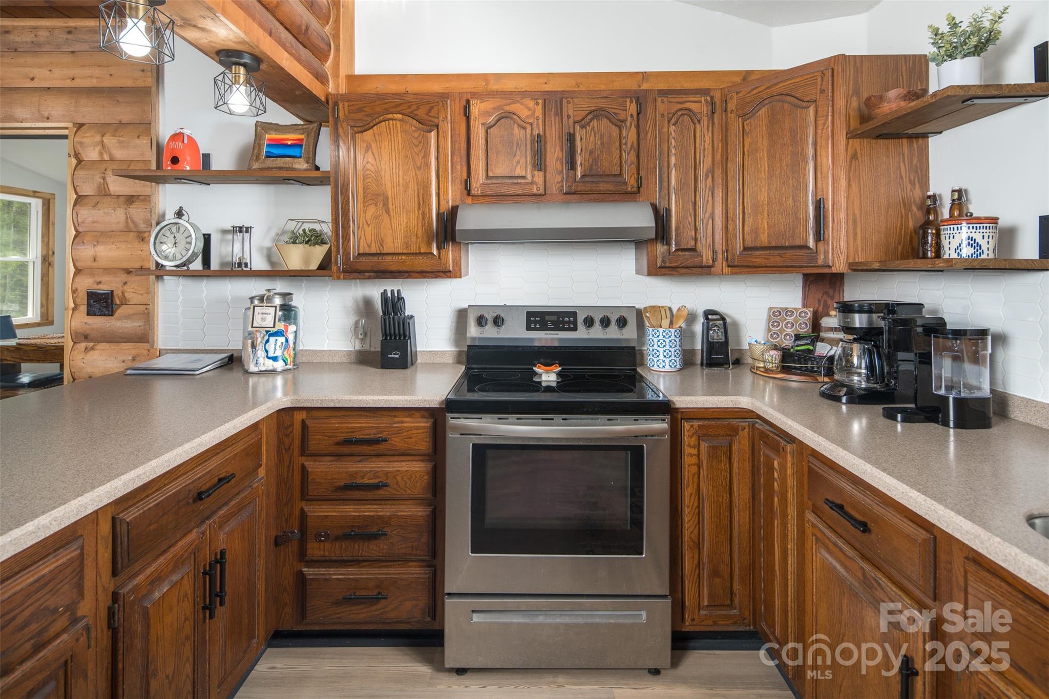 1090 Horse Bottom Road Banner Elk, NC 28604 - Photo 9 of 30 a kitchen with stainless steel appliances granite countertop a sink and cabinets