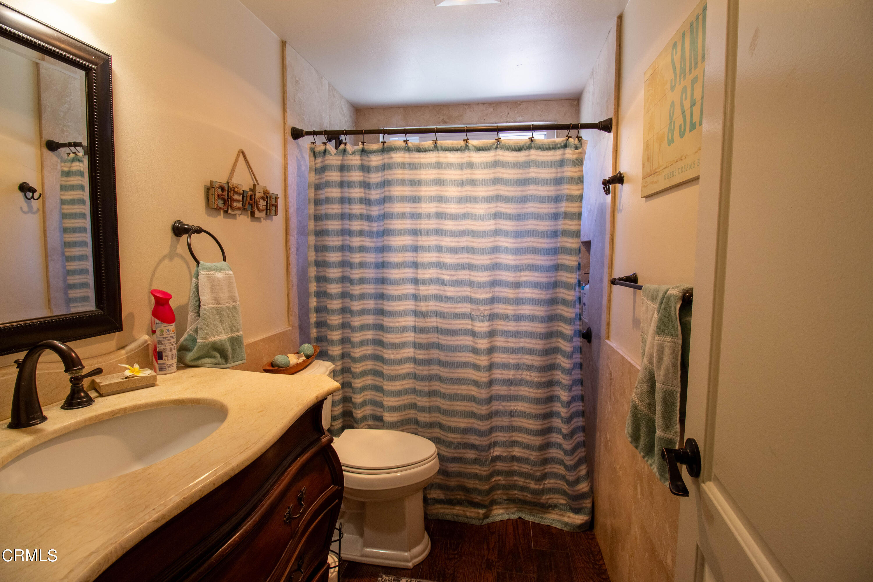 1300 Bluebell Street Oxnard, CA 93036 - Photo 11 of 24 a bathroom with a sink and a mirror