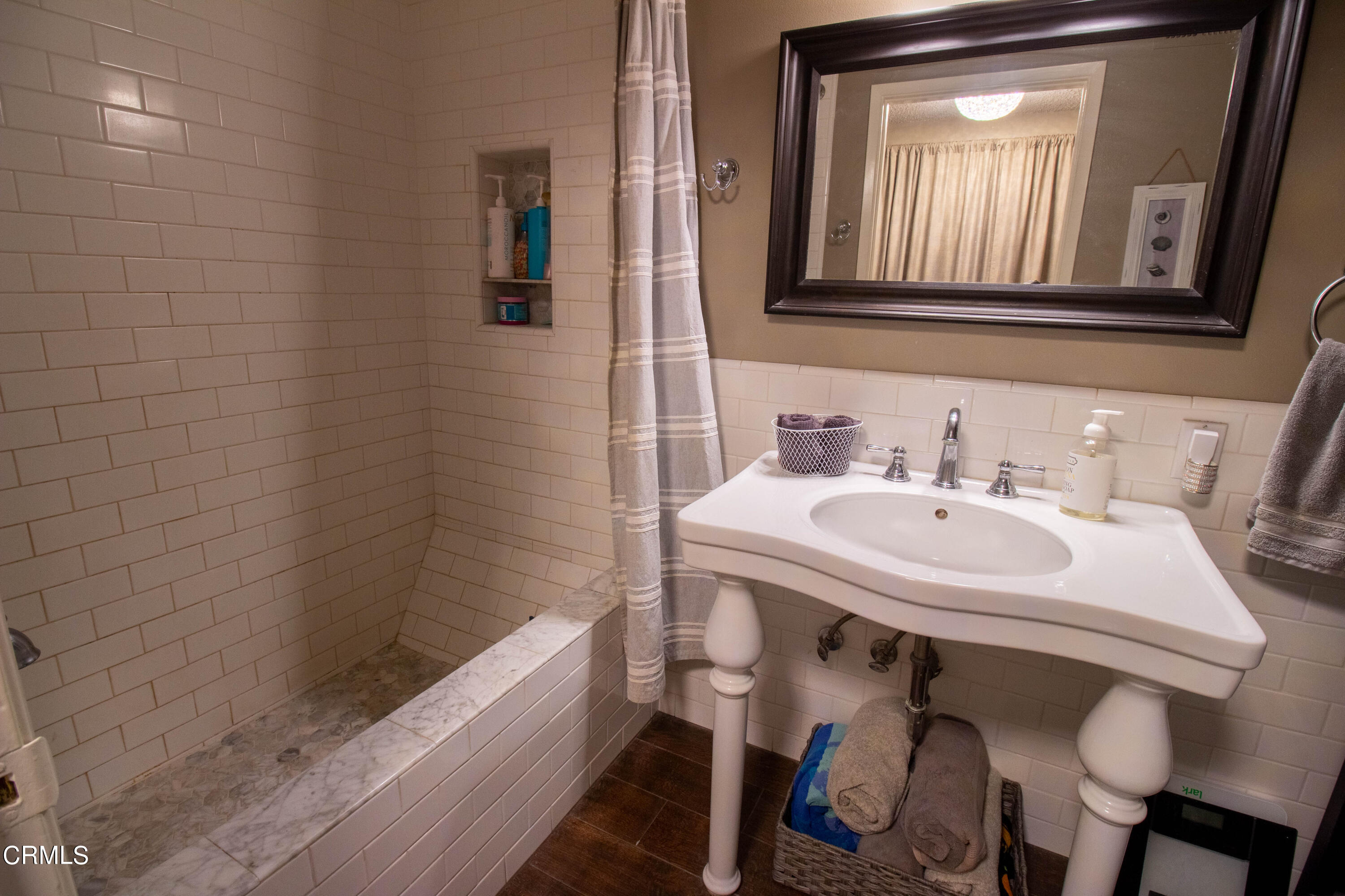 1300 Bluebell Street Oxnard, CA 93036 - Photo 12 of 24 a bathroom with a sink and a bathtub