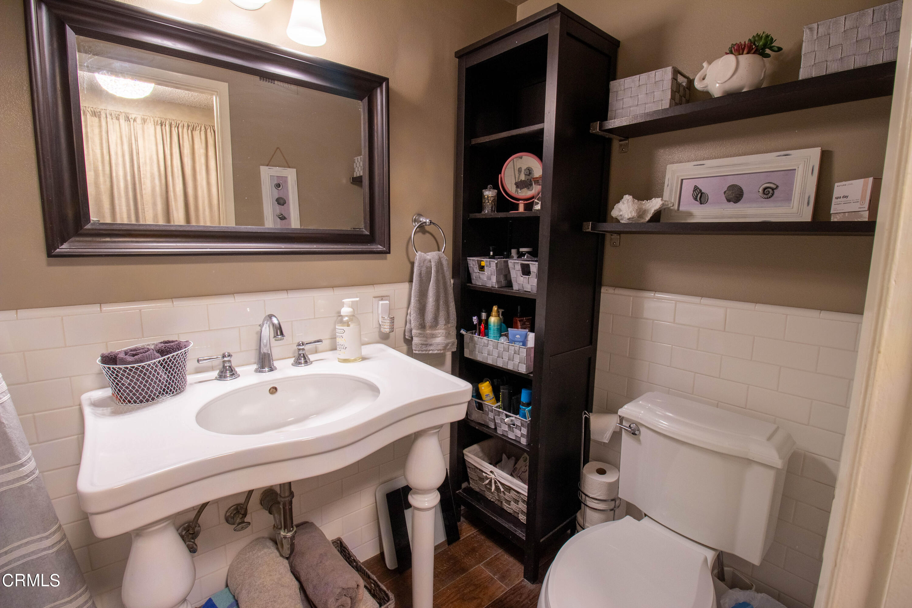 1300 Bluebell Street Oxnard, CA 93036 - Photo 13 of 24 a bathroom with a toilet a sink and a mirror