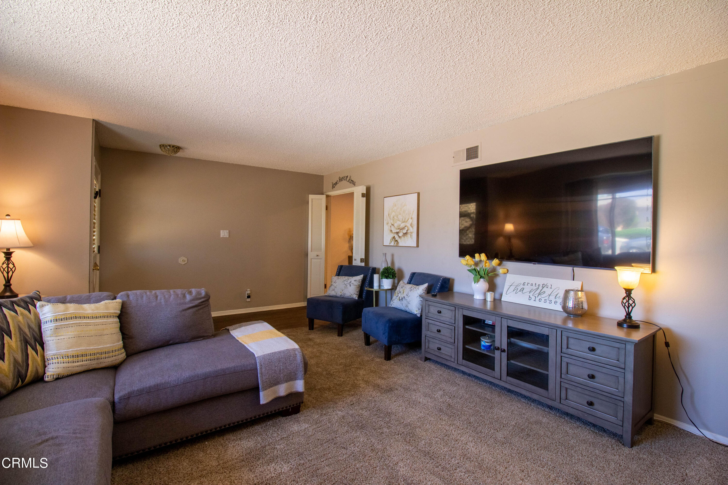 1300 Bluebell Street Oxnard, CA 93036 - Photo 14 of 24 a living room with furniture and a flat screen tv
