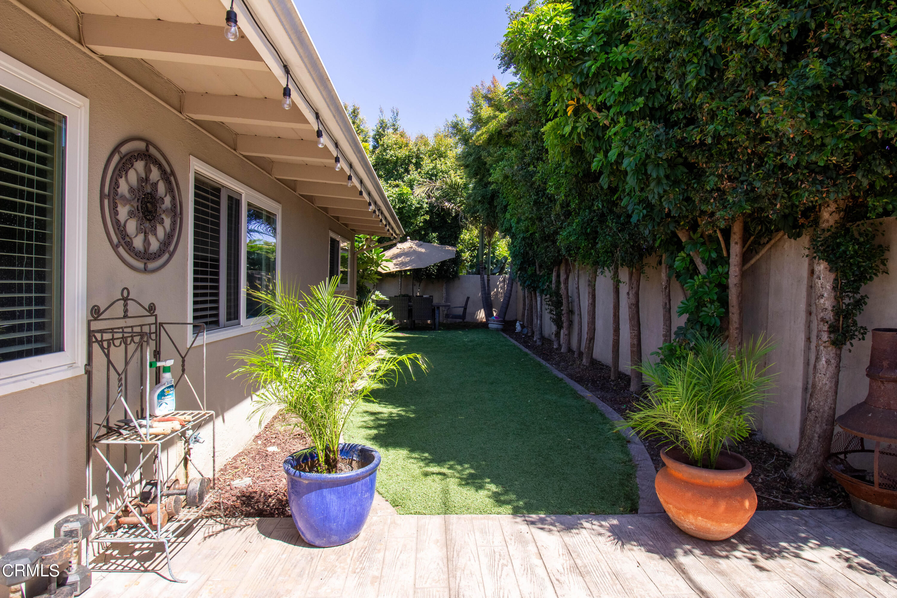 1300 Bluebell Street Oxnard, CA 93036 - Photo 16 of 24 a view of a house with a backyard and a patio