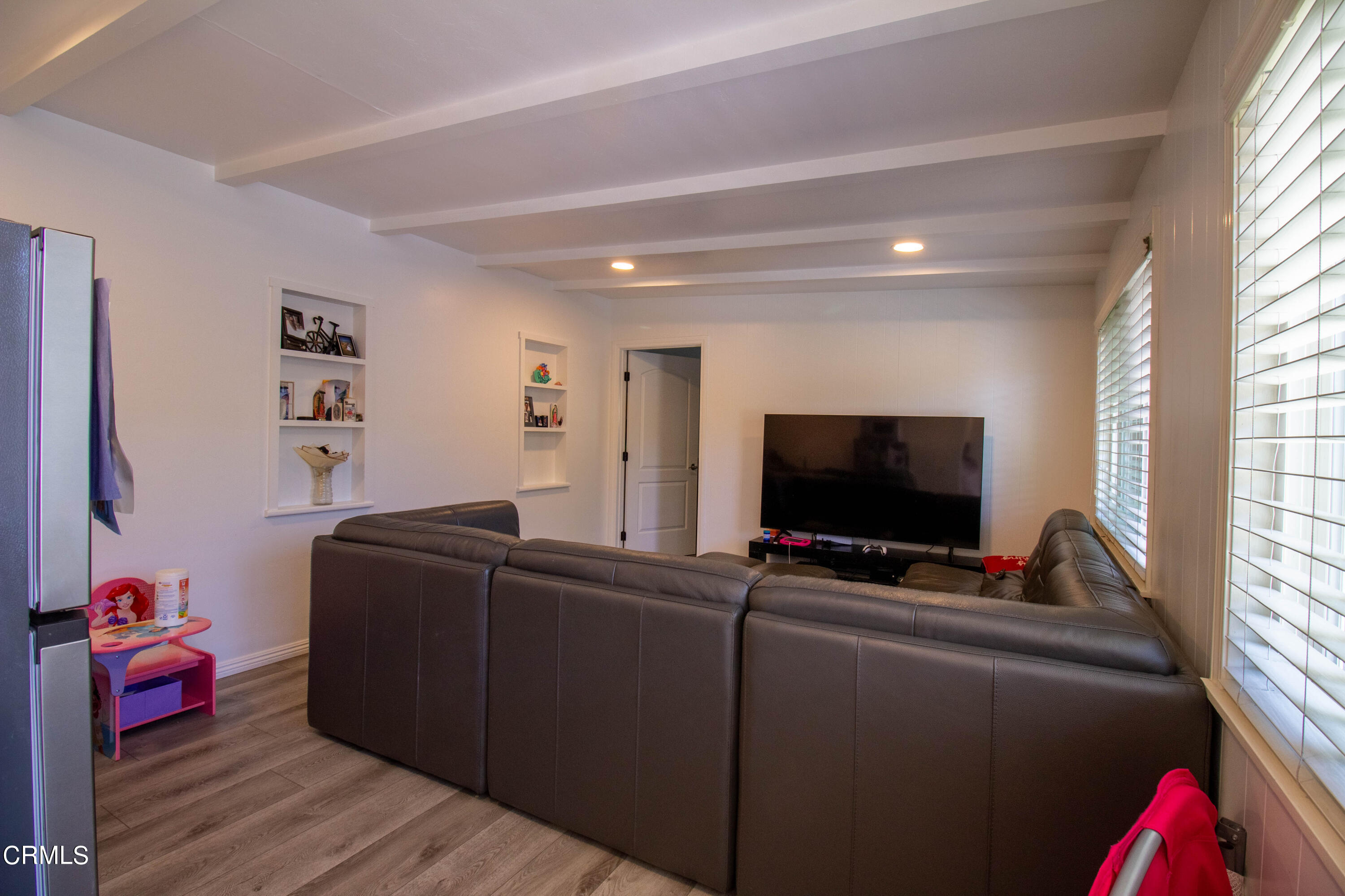 1300 Bluebell Street Oxnard, CA 93036 - Photo 19 of 24 a living room with furniture and a flat screen tv