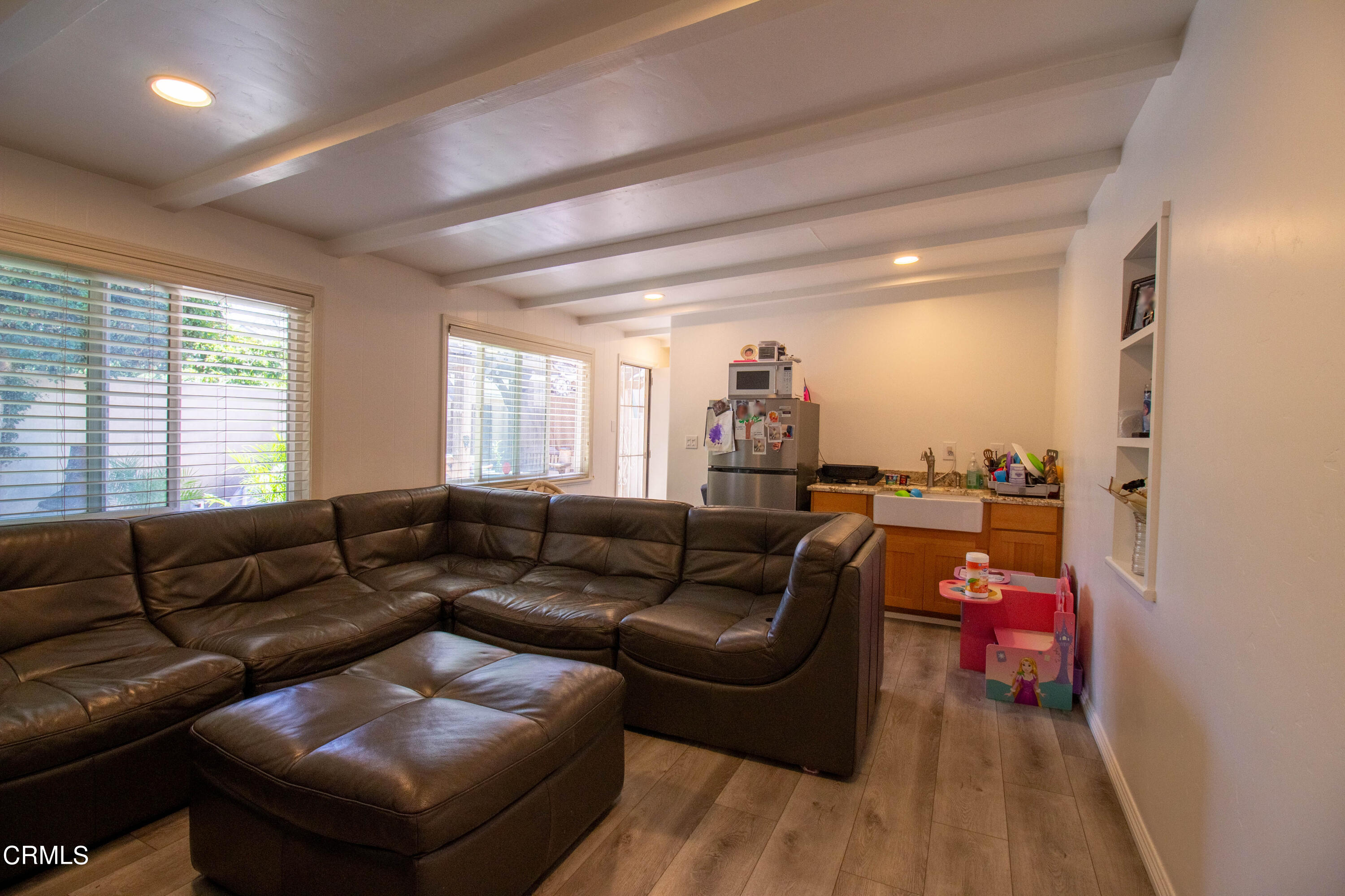 1300 Bluebell Street Oxnard, CA 93036 - Photo 20 of 24 a living room with furniture and a wooden floor