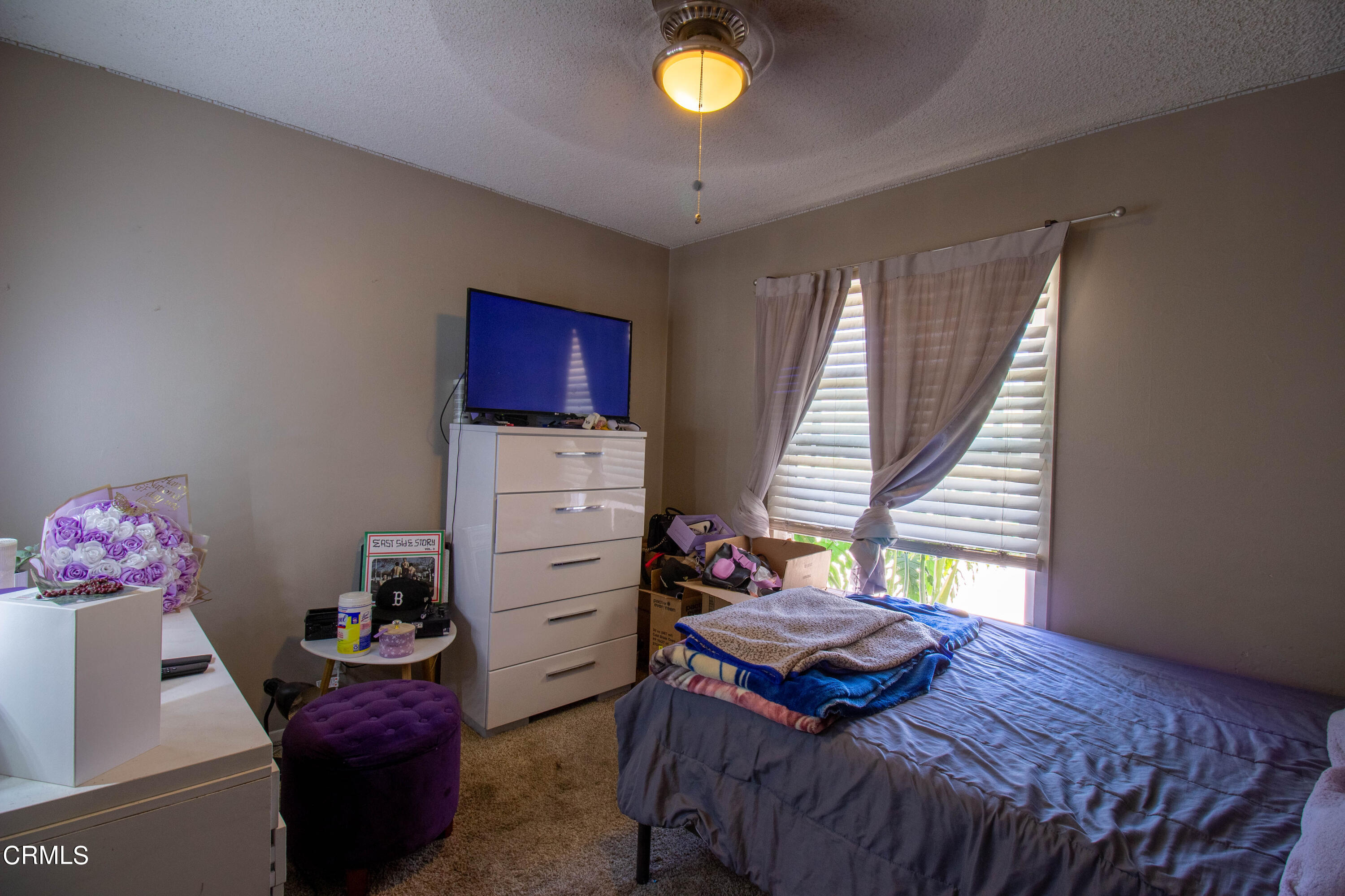 1300 Bluebell Street Oxnard, CA 93036 - Photo 8 of 24 a bedroom with a bed and window