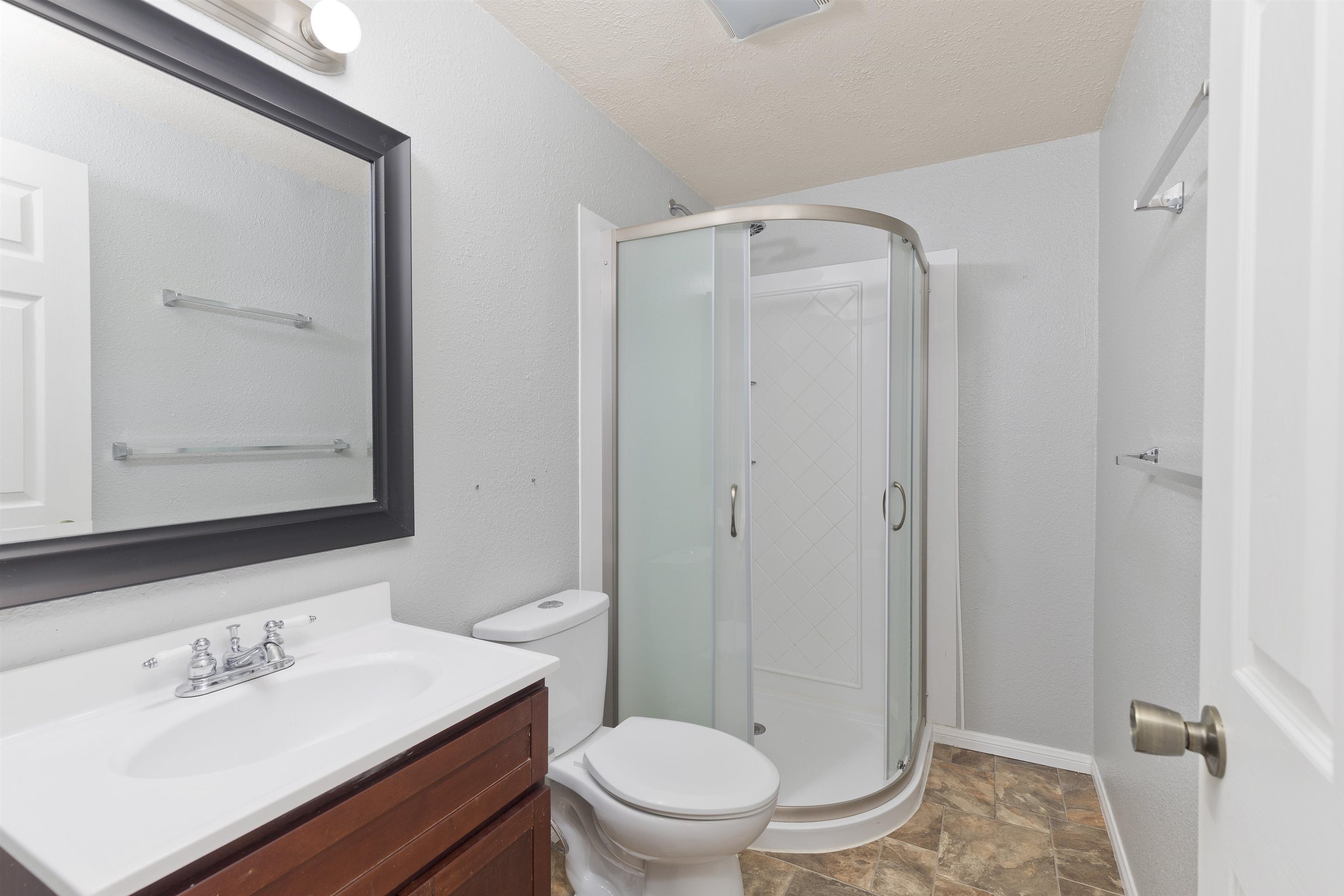 165 Old Mammoth Road, Unit 132 Mammoth Lakes, CA 93546 - Photo 14 of 26 a bathroom with a sink a toilet a mirror and shower