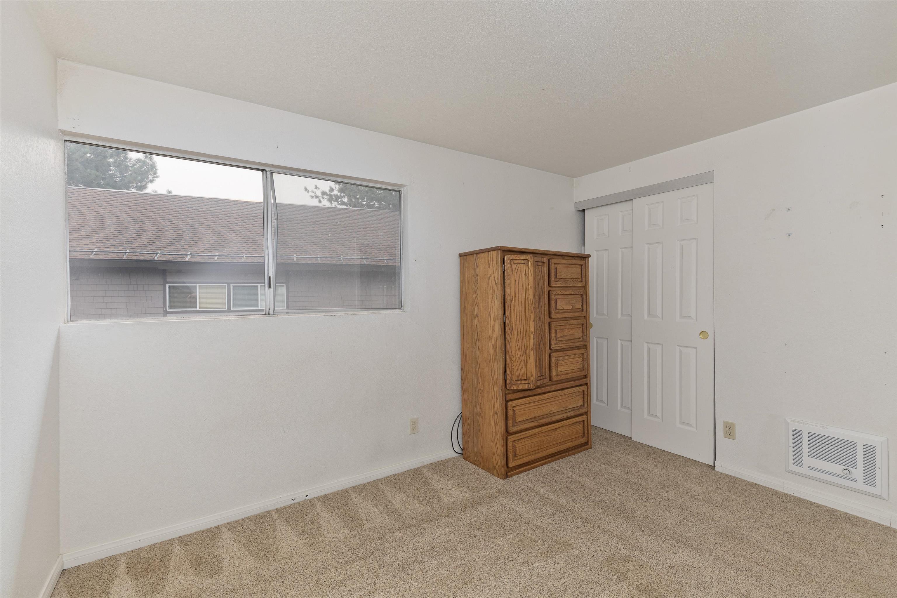 165 Old Mammoth Road, Unit 132 Mammoth Lakes, CA 93546 - Photo 15 of 26 an empty room with a window and cabinet