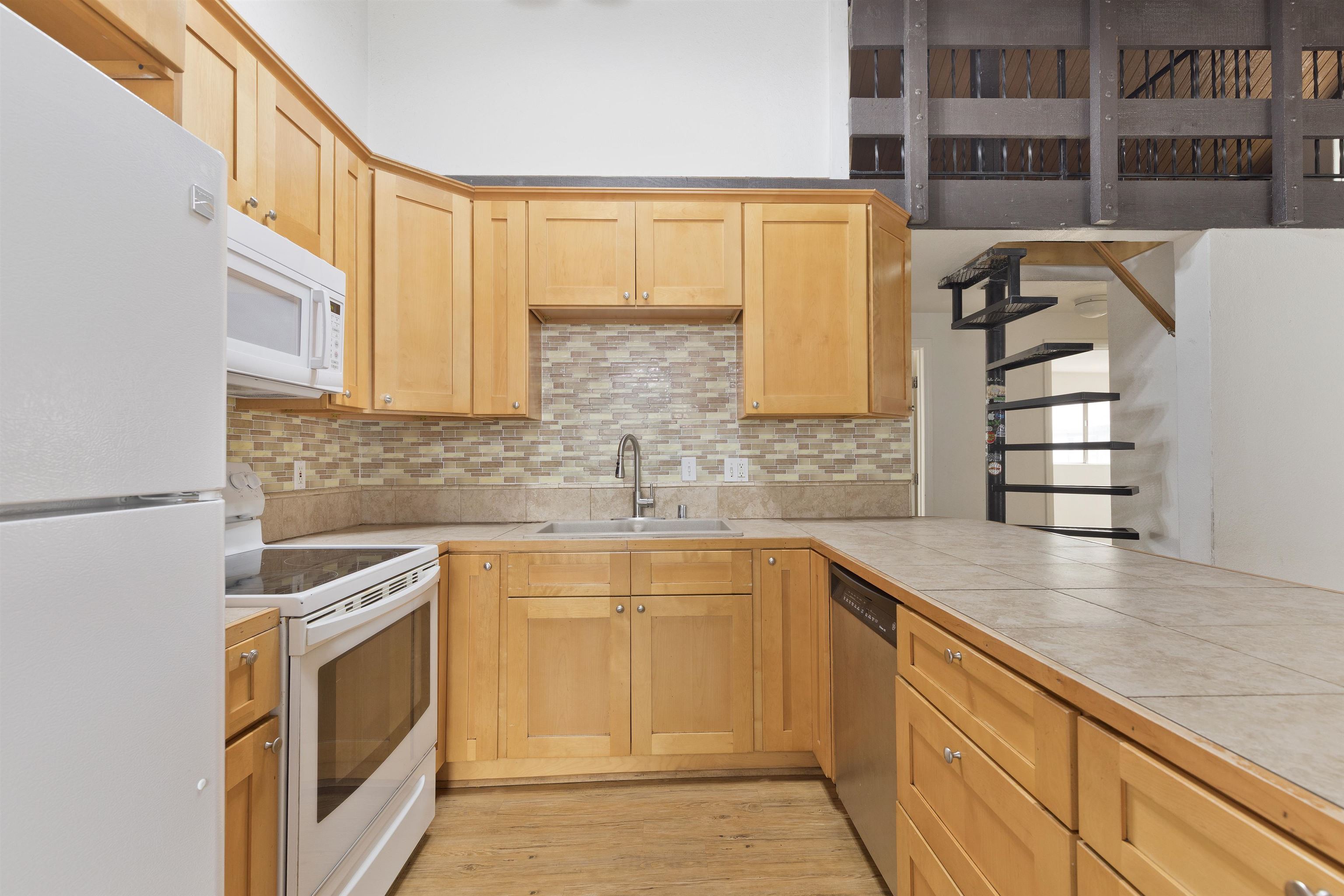 165 Old Mammoth Road, Unit 132 Mammoth Lakes, CA 93546 - Photo 4 of 26 a kitchen with a sink and a stove top oven