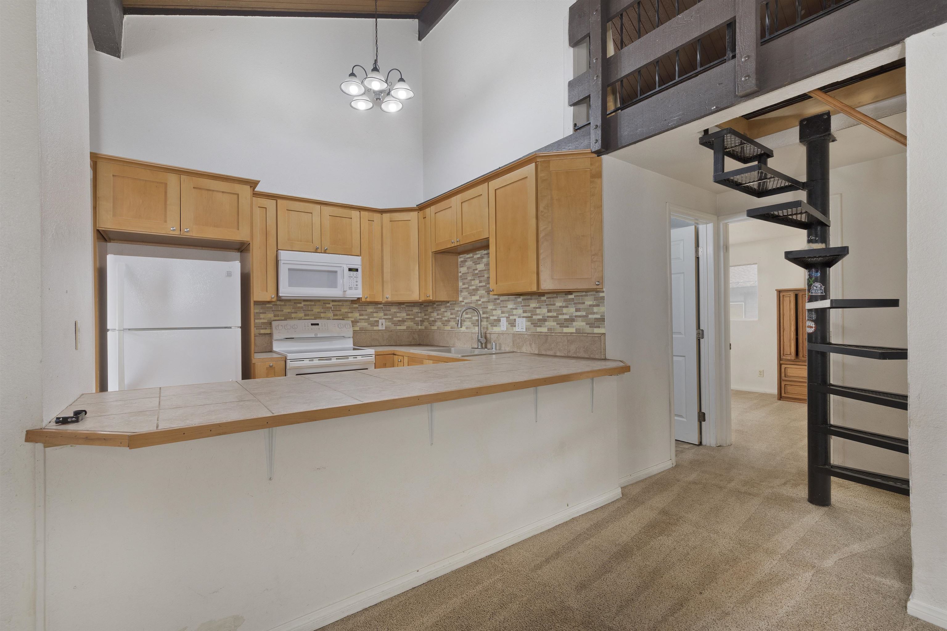 165 Old Mammoth Road, Unit 132 Mammoth Lakes, CA 93546 - Photo 7 of 26 a view of a kitchen with a sink and cabinets
