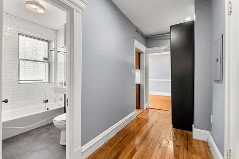 a bathroom with a bathtub and a toilet