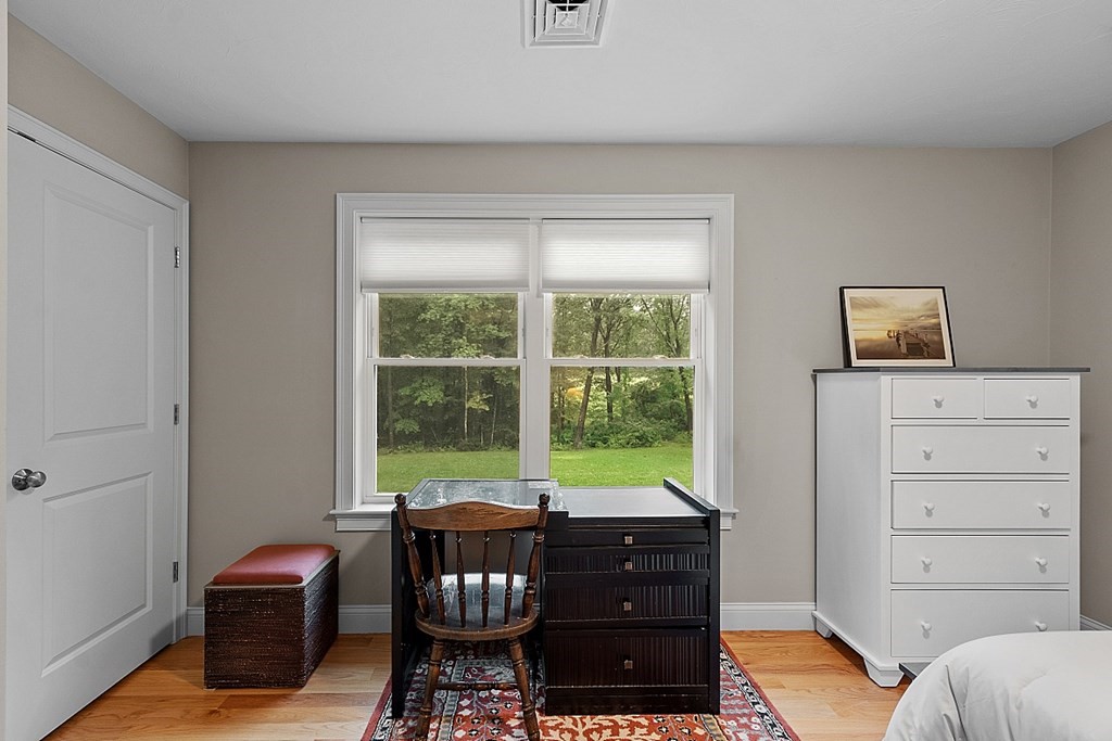 24 Little Turnpike Road Shirley, MA 01464 - Photo 17 of 42 a view of a workspace with furniture and a window
