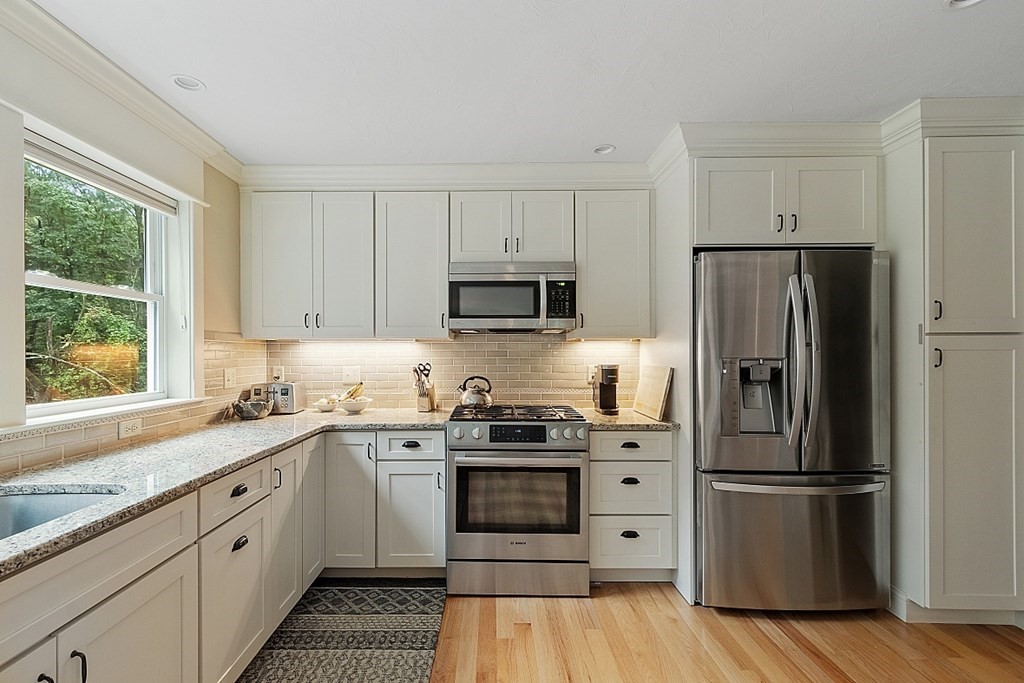 24 Little Turnpike Road Shirley, MA 01464 - Photo 33 of 42 a kitchen with a refrigerator stove and microwave