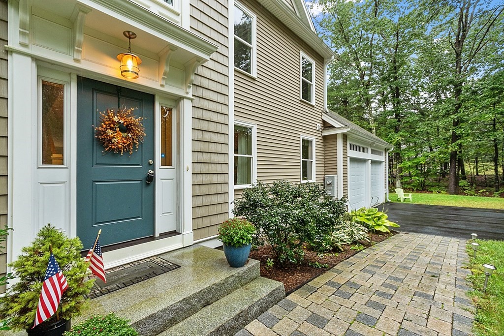 24 Little Turnpike Road Shirley, MA 01464 - Photo 4 of 42 a front view of a house with a garden
