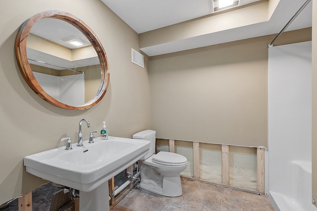 24 Little Turnpike Road Shirley, MA 01464 - Photo 41 of 42 a bathroom with a sink and a mirror