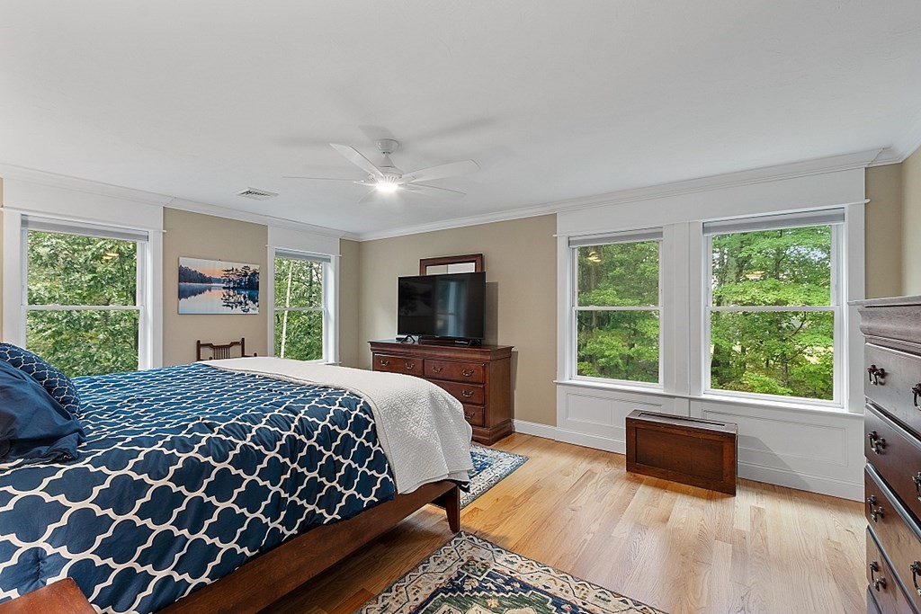 24 Little Turnpike Road Shirley, MA 01464 - Photo 9 of 42 a bedroom with a large bed and a large window