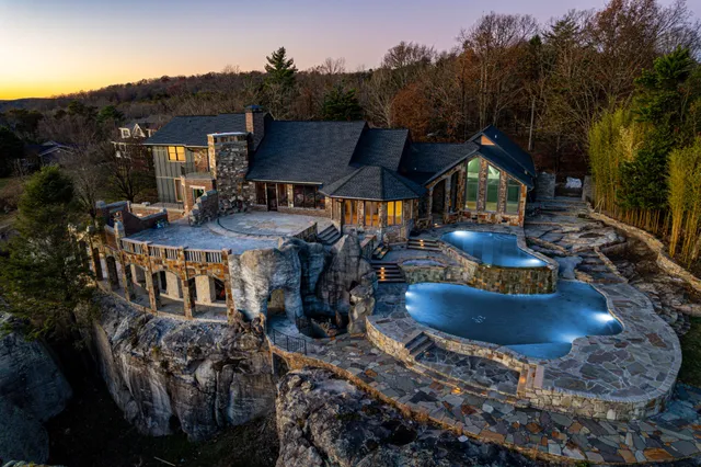 a view of a house with table and chairs