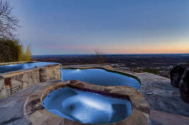 a view of a room with wooden floor and chair