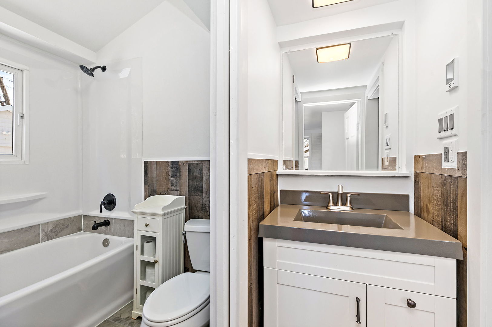 612 South Webster Street Aurora, IL 60505 - Photo 17 of 24 a bathroom with a granite countertop toilet sink and mirror